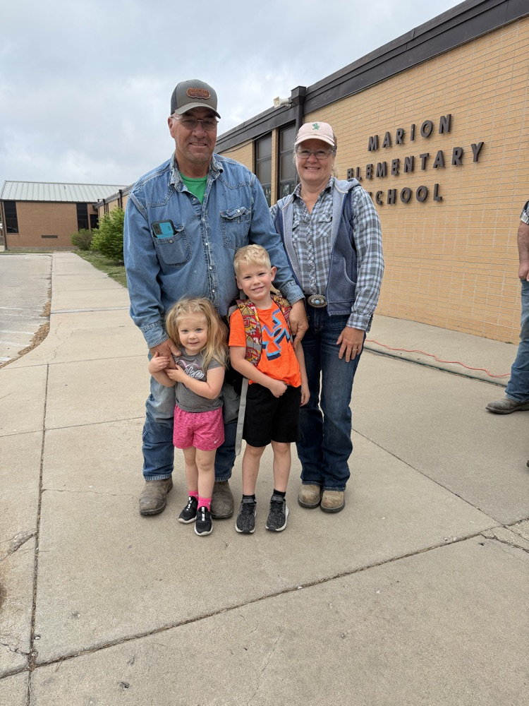 Two students with their grandparents 