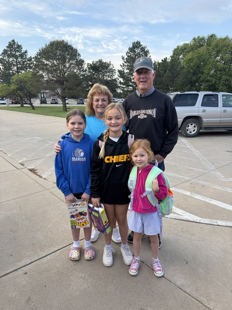 Three grandkids with their grandparents