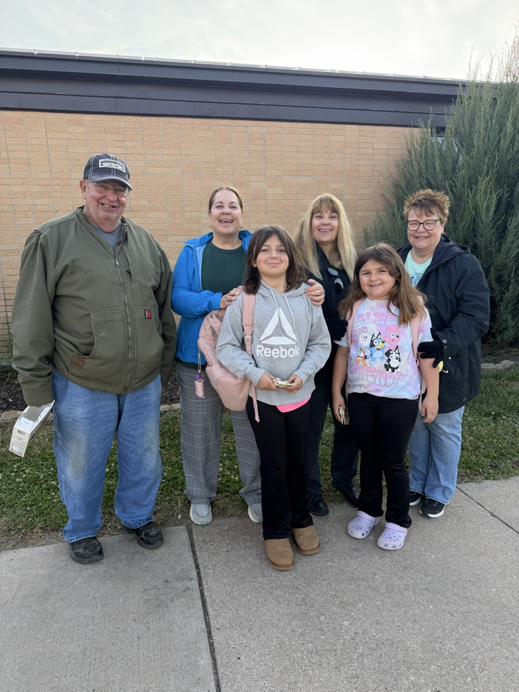 Two MES students with 2 sets of grandparents and their aunt