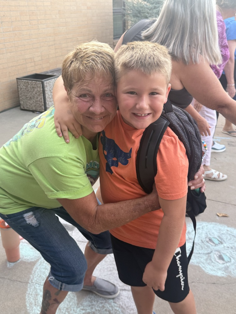 our retired custodian gets a hug from her grandson