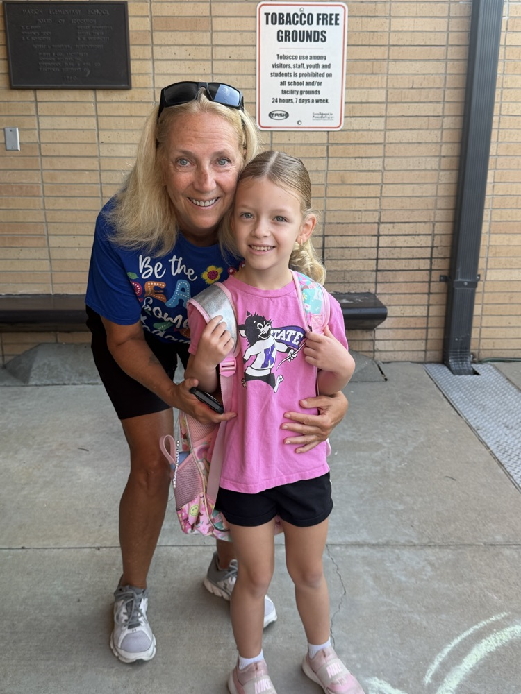 Our retired PE teacher gets a hug from her granddaughter