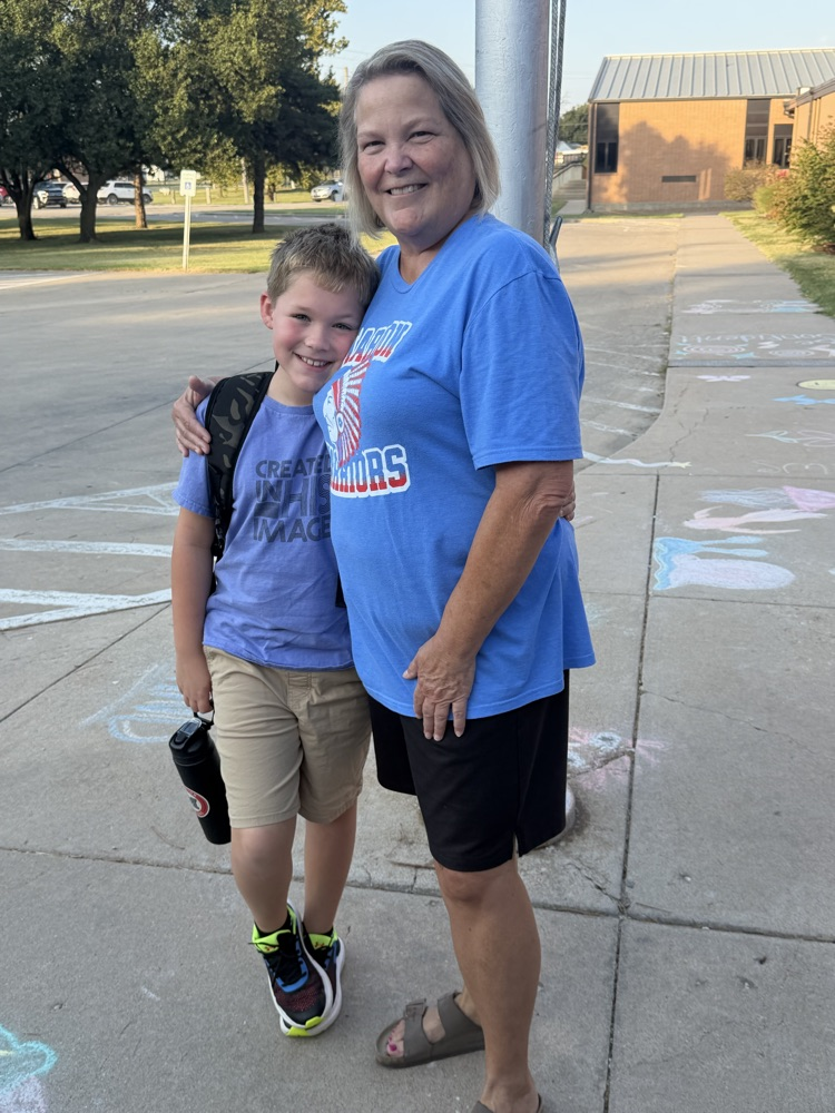 Our retired librarian gets a hug from her grandson
