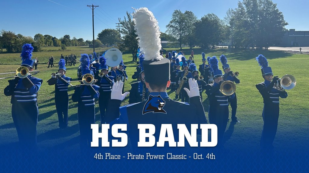 The drum major conducts the MCE band