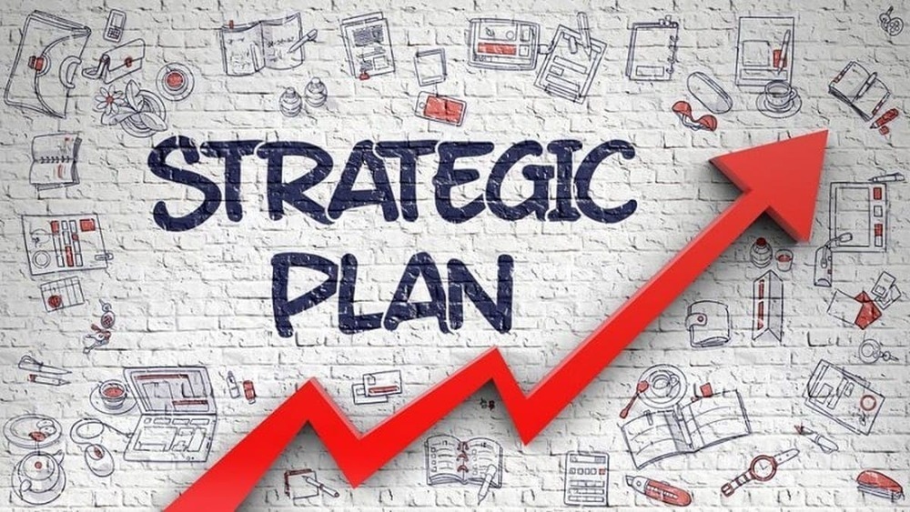Decorative Image: The words "strategic plan" placed boldly in the center with small illustrations of books, computers and other tech devices surrounding