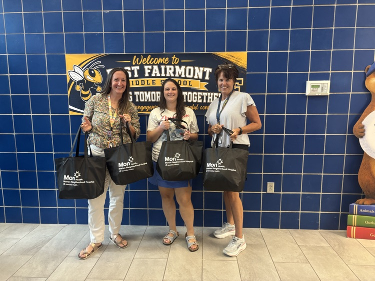 counselors and paterline holding donations