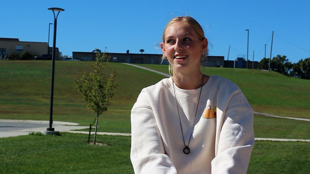 Student sitting outside