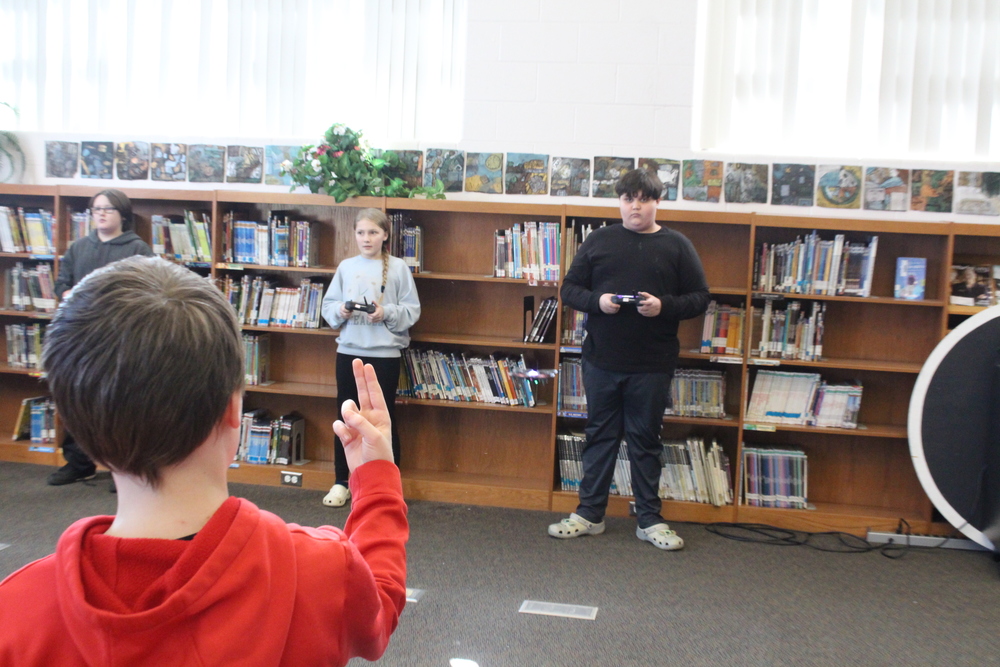 students flying drone