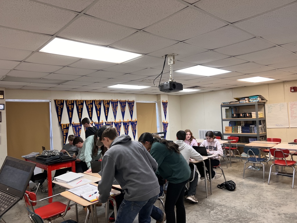 Students working on power point presentations