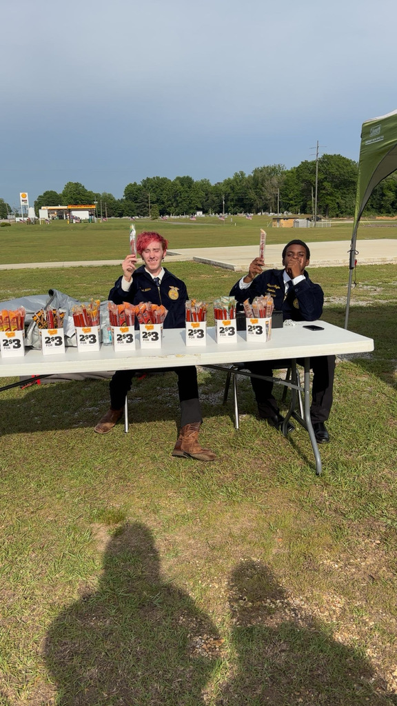 Daniel and Kamahri selling meatsticks