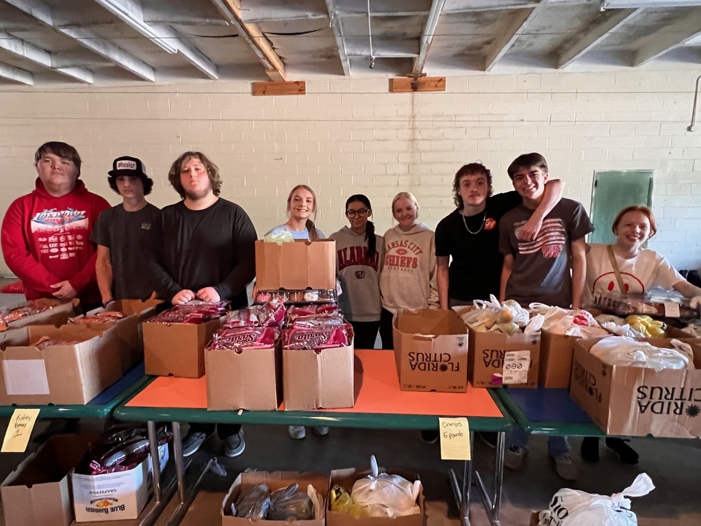 Students working Feed My Sheep Food Distribution
