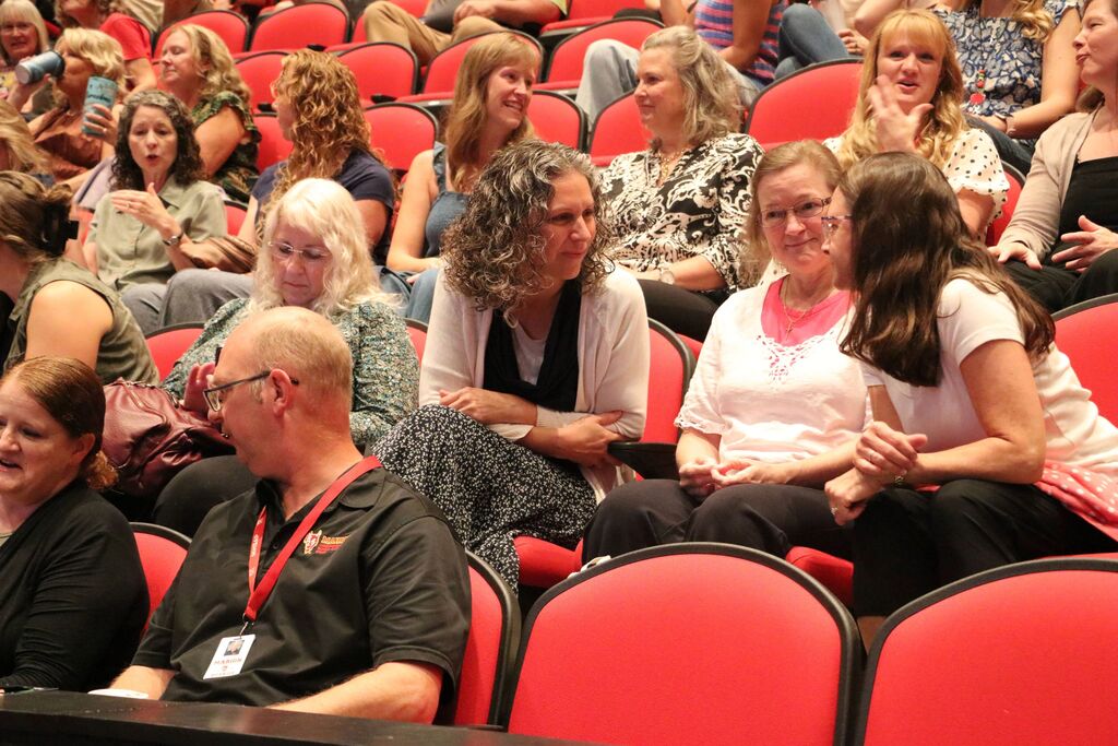 Staff sitting in the auditorium.