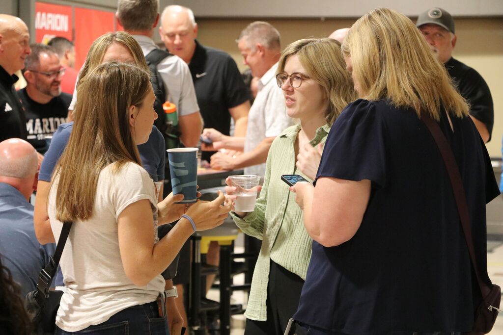 Staff sip on coffee.