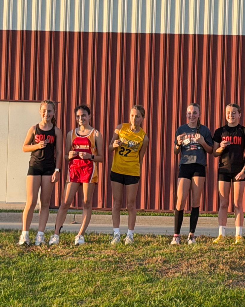 Top XC Runners displaying Medals