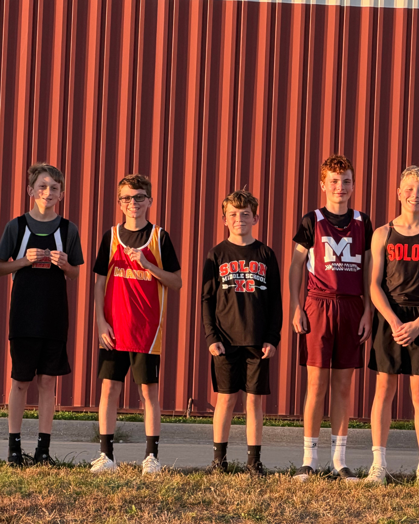 Top XC Runners displaying Medals
