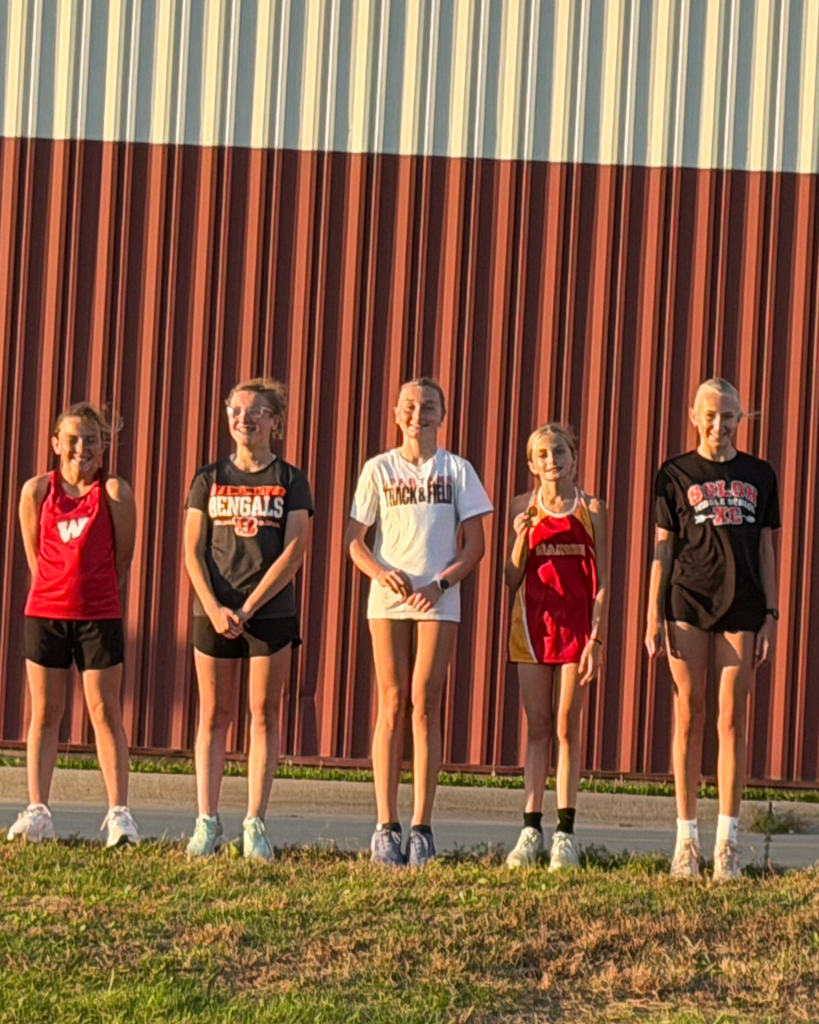 Top XC Runners displaying Medals