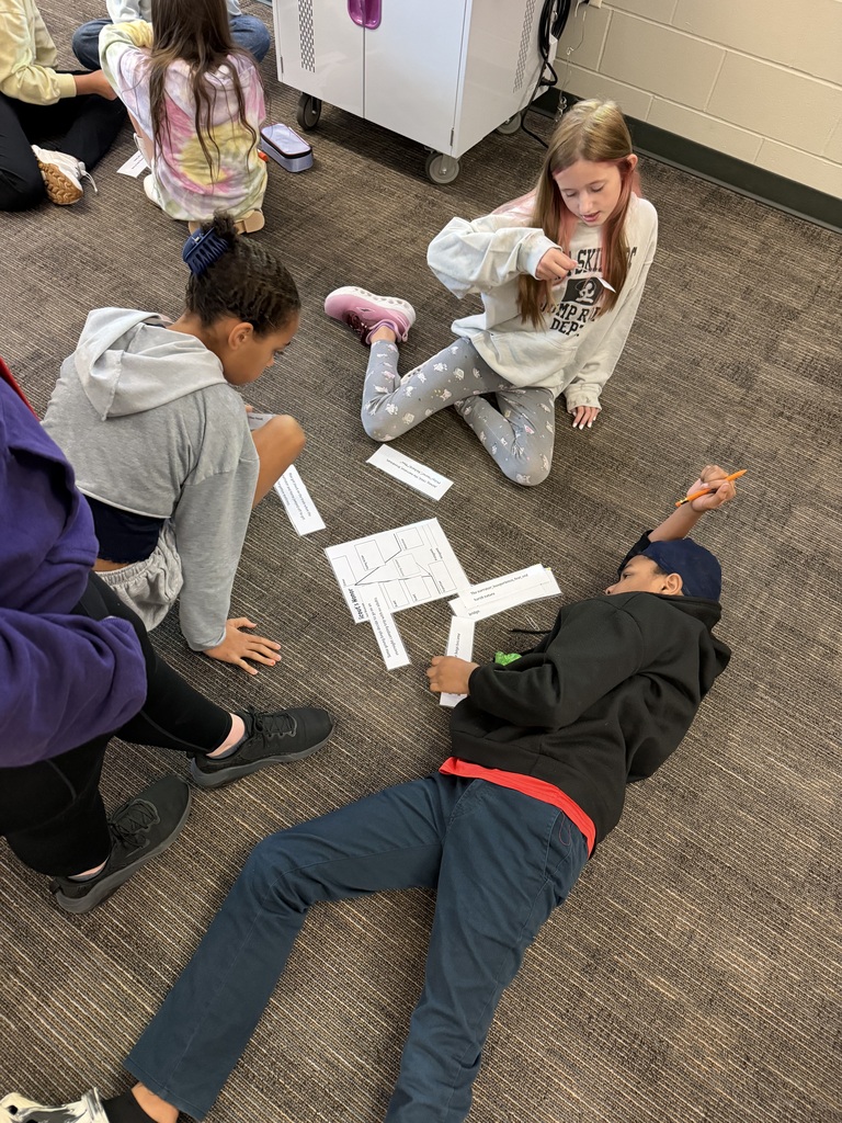 Students working on literacy sorting activity.