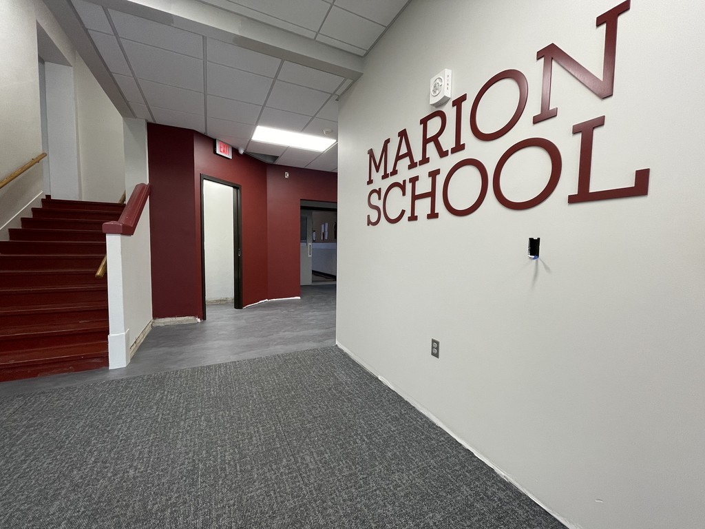 The "Marion School" sign with new flooring, painting, and ceiling.