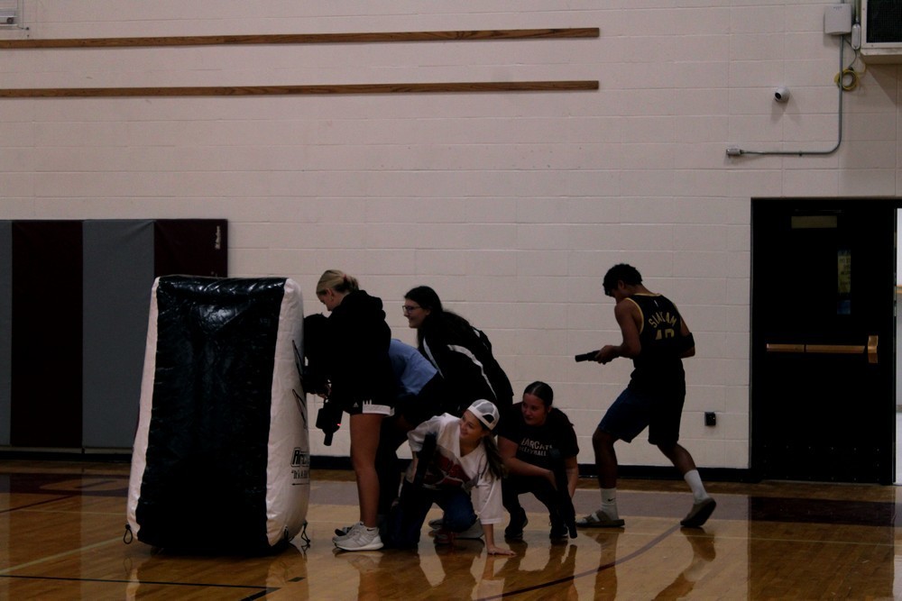 Students playing laser tag