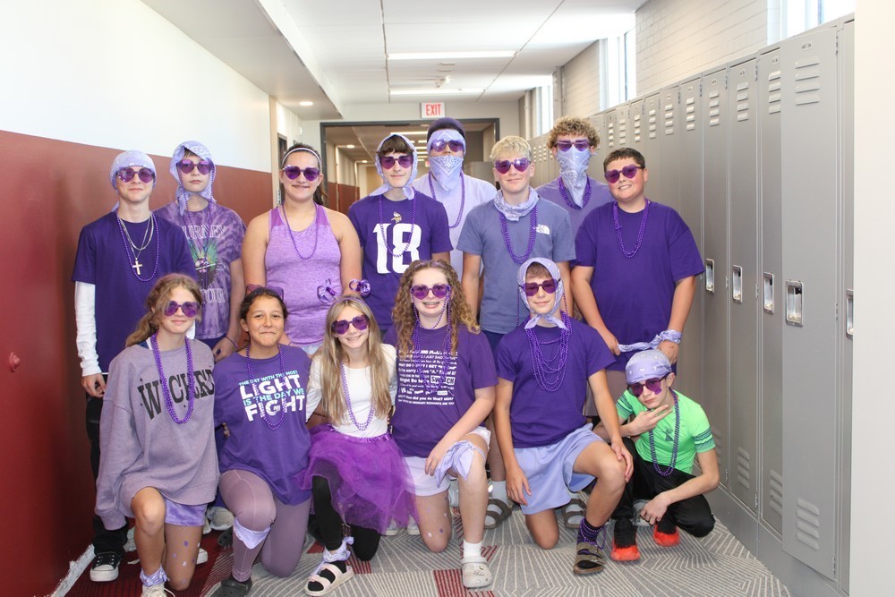 students all dressed in purple for homecoming