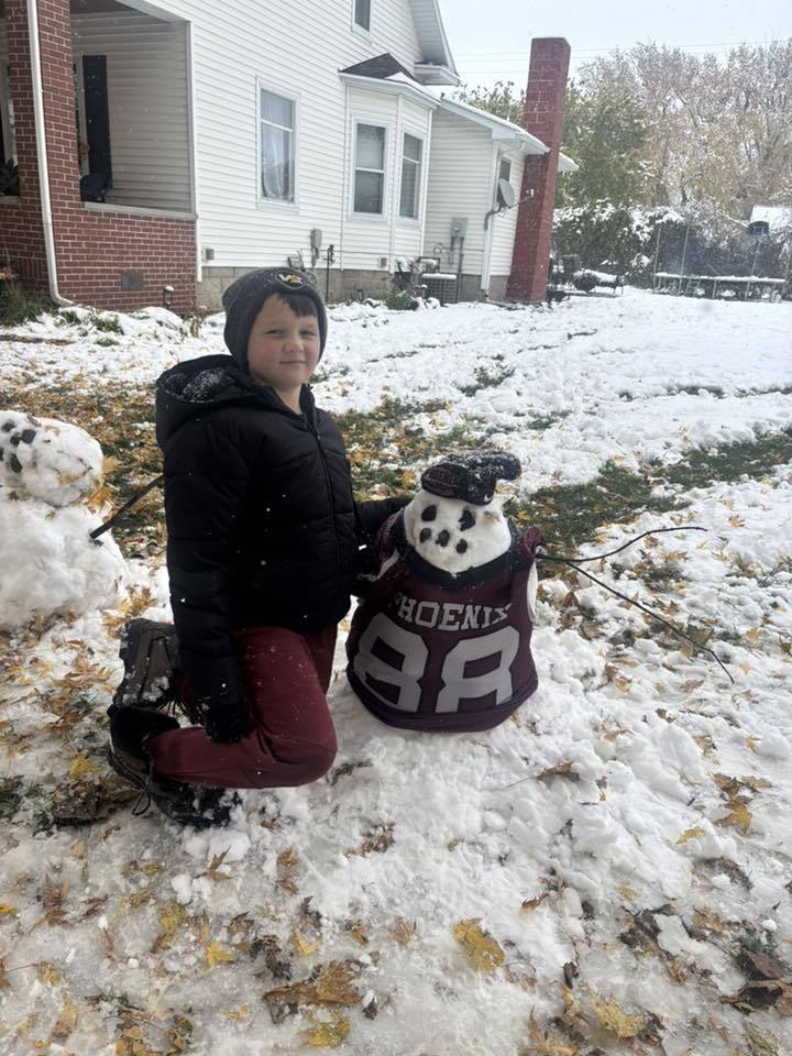 1 boy with phoenix snowman