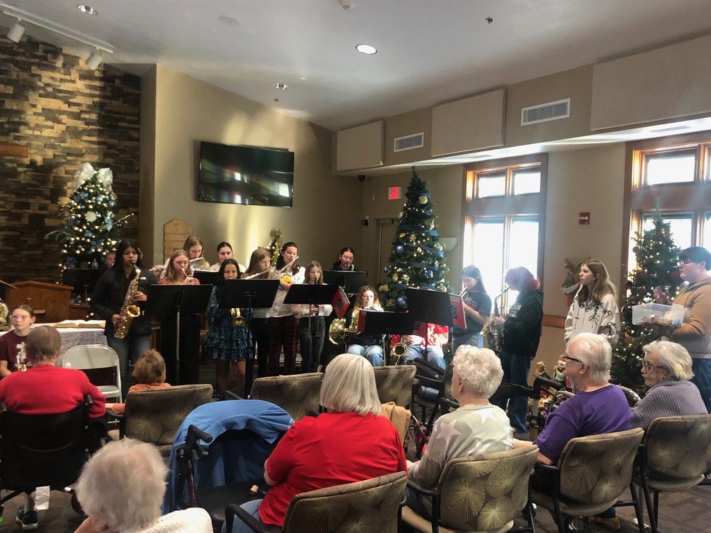 Students playing instruments at nursing home