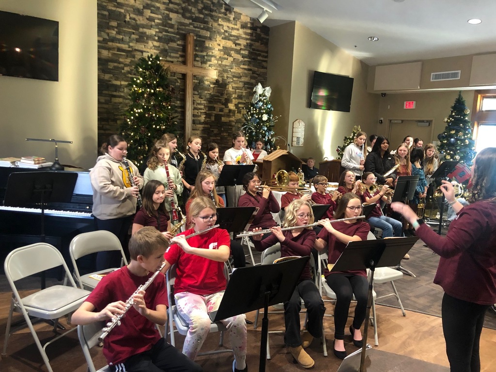 Students playing instruments at nursing home