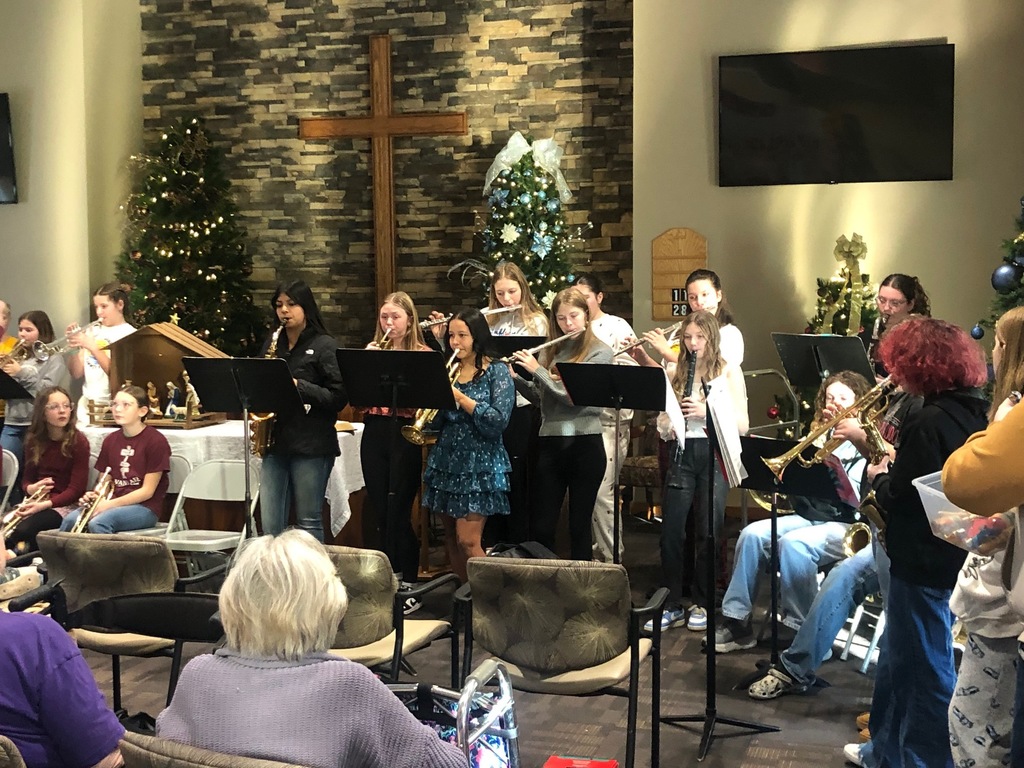 Students playing instruments at nursing home