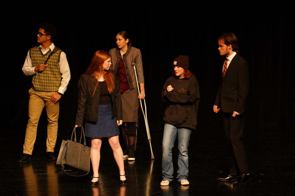 5 students acting on stage