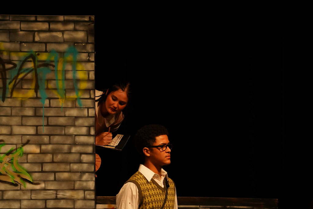 2 students acting on stage