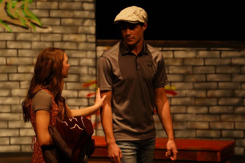 2 students acting on stage