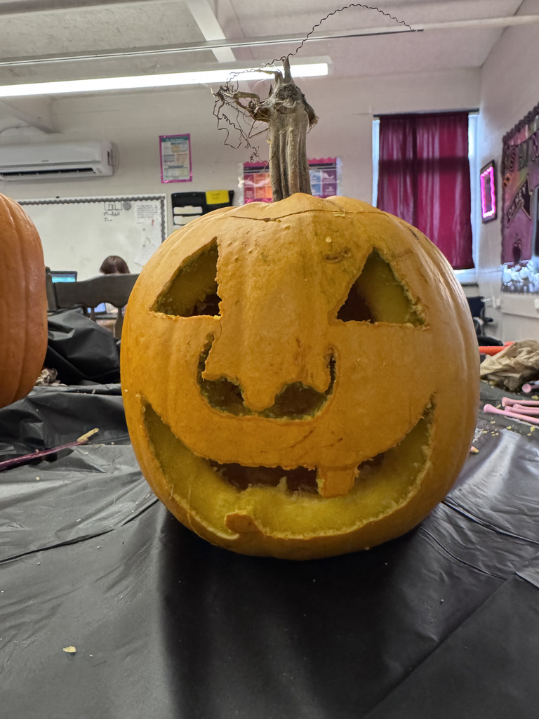 Students carving pumpkins