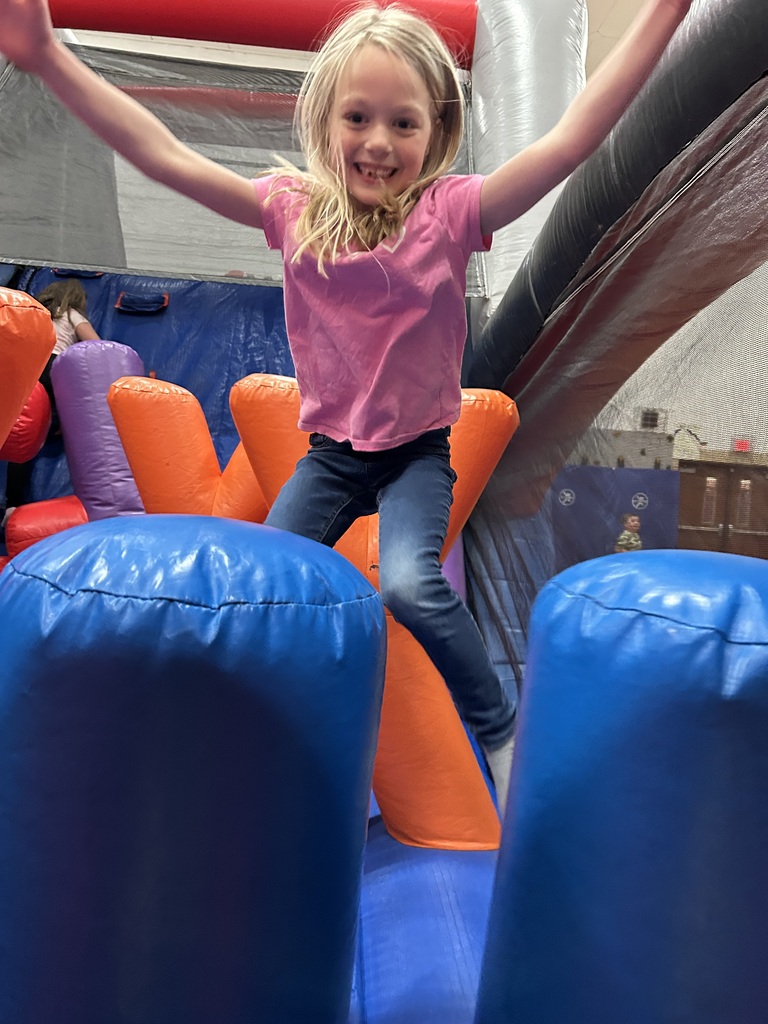 Kids on bounce house.