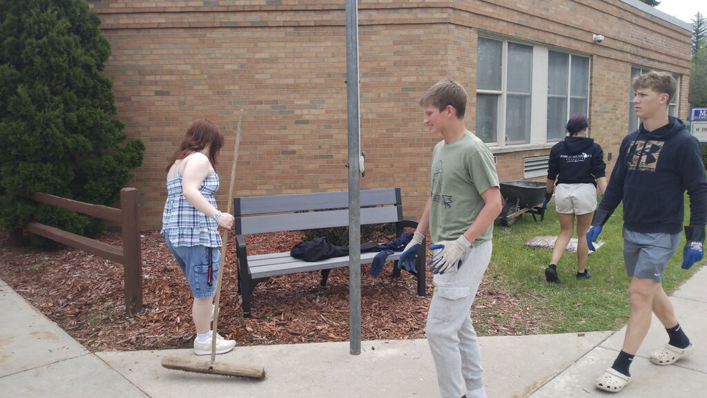 Students cleaning the elementary