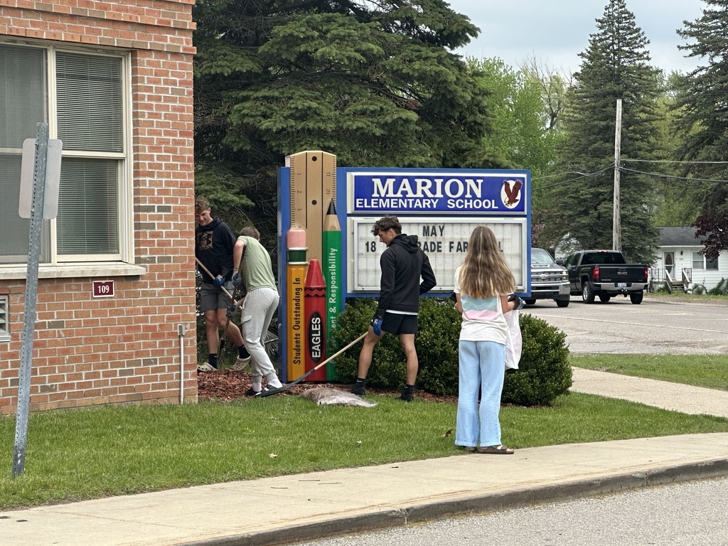 Students cleaning the elementary