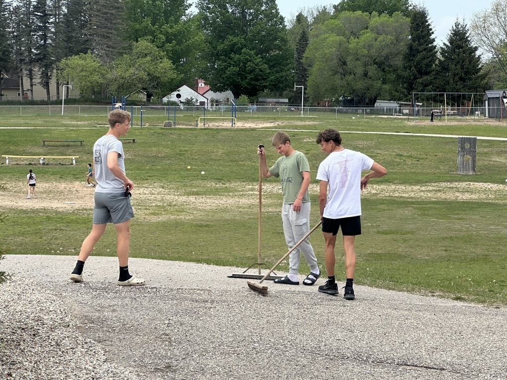 Students cleaning the elementary