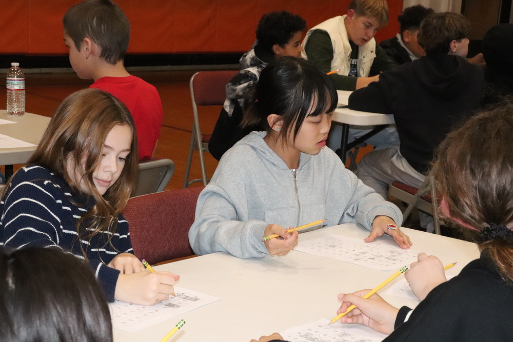 Students at a table playing bingo