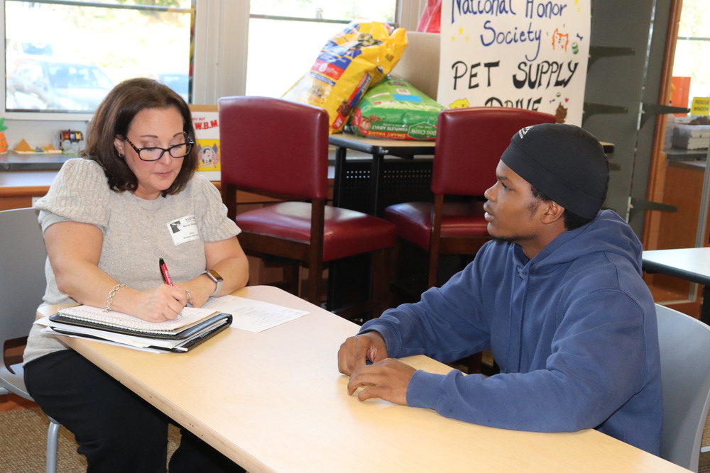 A recruiter and a student engage in a mock interview