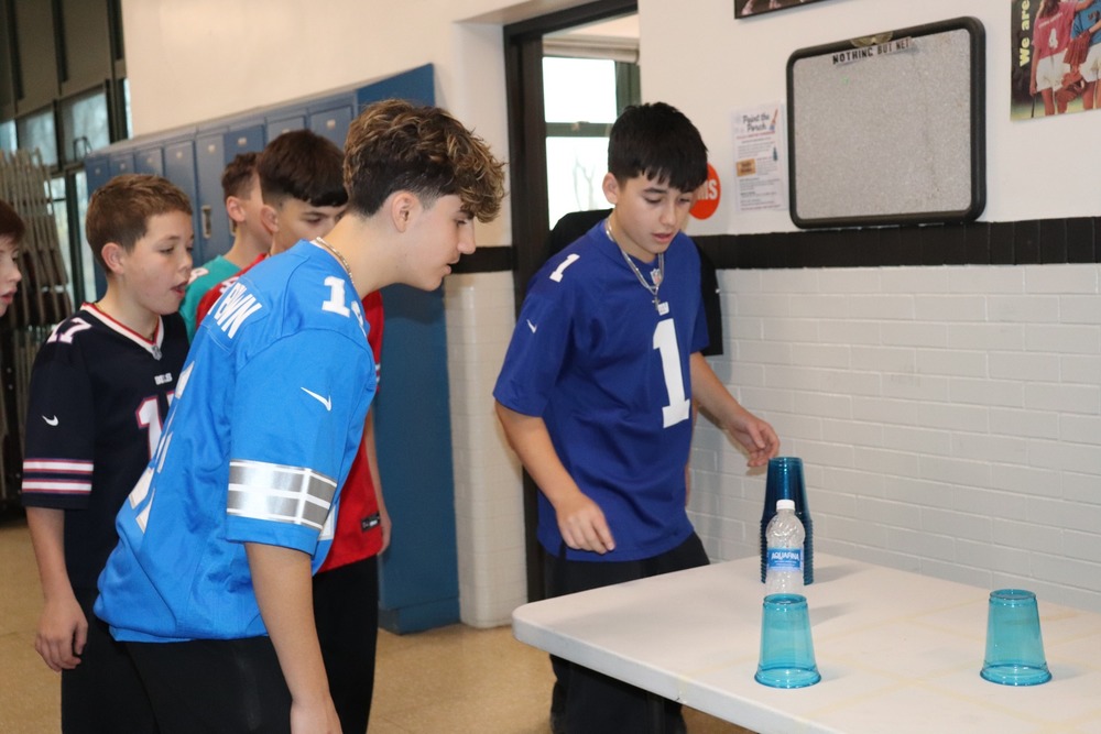 Students playing a game at a table