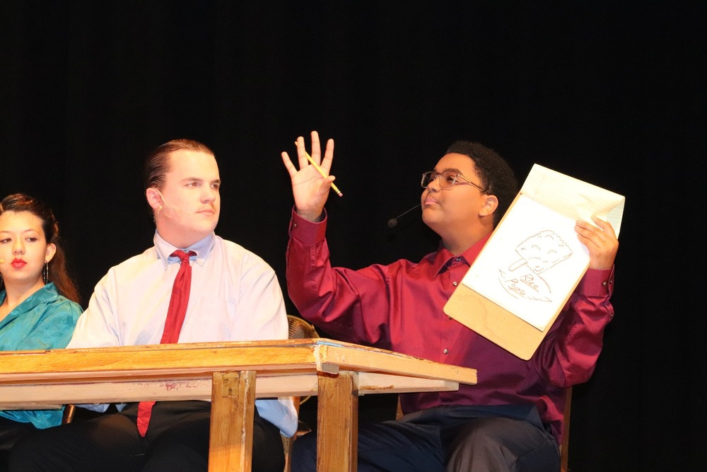 Cast members on stage