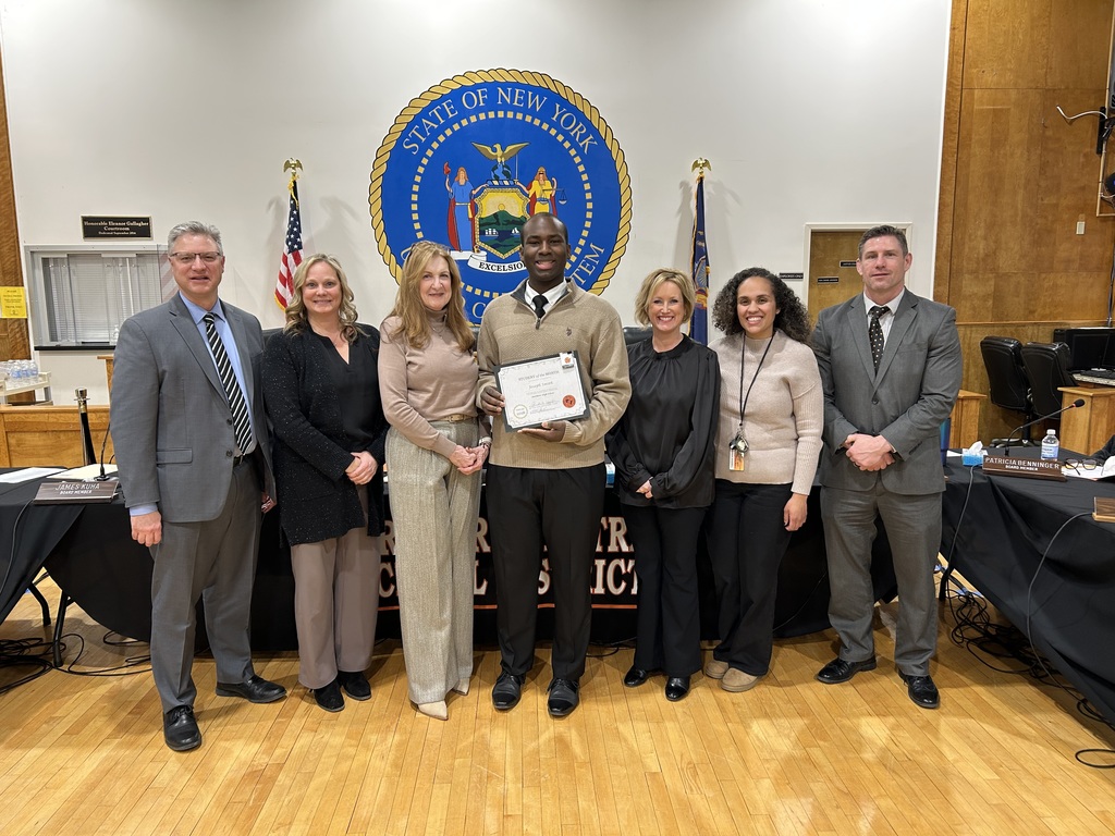 High School Student of the Month with a group