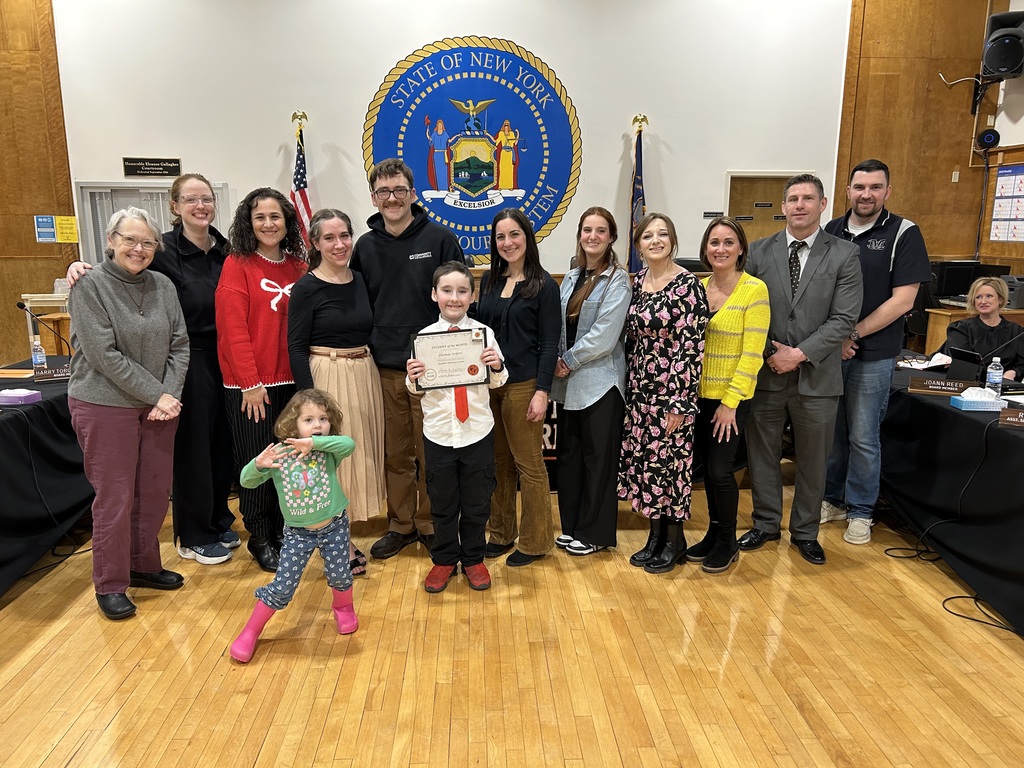 Elementary School Student of the Month with a group