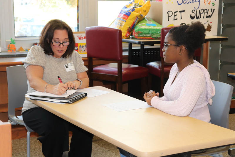 A recruiter and a student engage in a mock interview