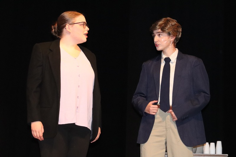 Cast members on stage