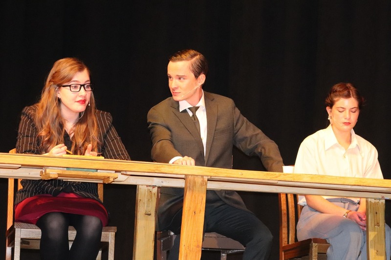 Cast members on stage