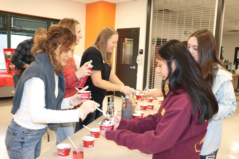 A student is served ice cream