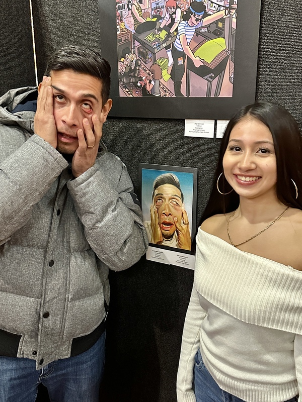Gabriella and her Father with her art