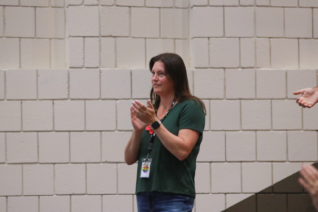 Mrs. Sarah Poulin cheering for colleagues during this morning's EL assembly.