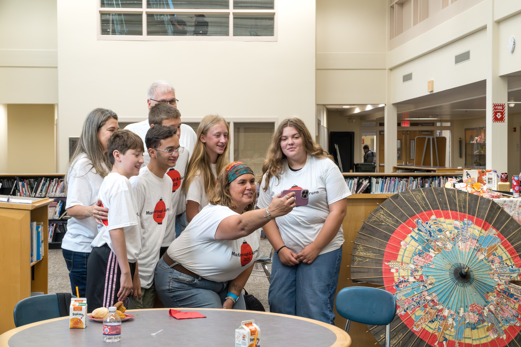 Japanese student exchange program Advisor Jen Smith takes a selfie with five student delegates and two staff members.