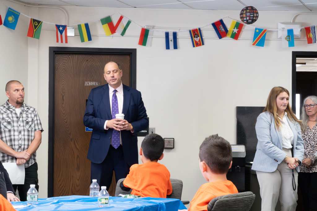Senator Eldridge stands and talks with Richer School students.