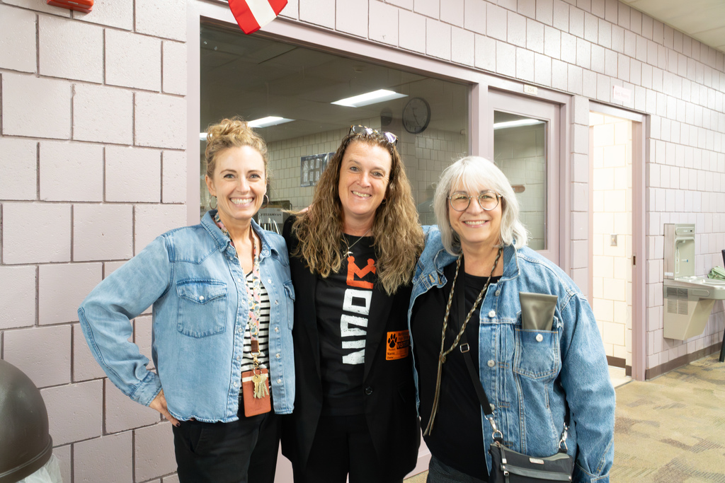 Two Marlborough School Committee members pose for a group photo with an MHS staff member.